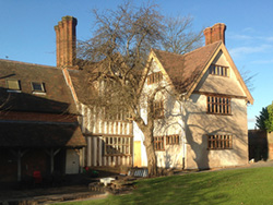 exterior view of the timber framed gables of Bells farmhouse