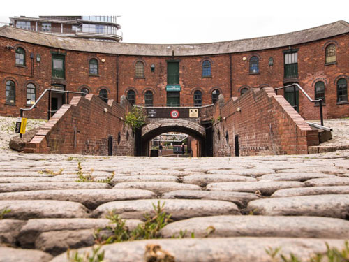 view of roundhouse and cobbled courtyard