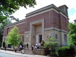 exterior view of the Barber Institute with people on the steps on a bright summer's day